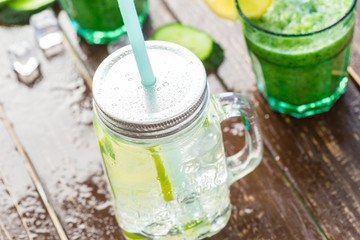 Lemonade drink in a jar glass on wooden background