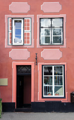Fototapeta na wymiar Part of the facade of an old red house, Riga, Latvia