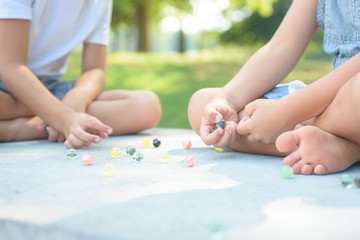 Kids playing marbles game outside