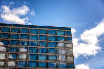 Facade of a modern building against the blue sky
