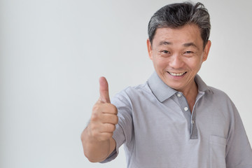 happy, successful, positive middle aged man showing thumb up - obrazy, fototapety, plakaty