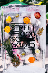 Piece of ice with lettering ' Street food'