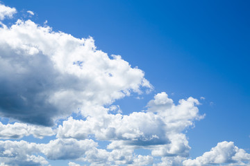 Naklejka na ściany i meble Blue sky with clouds in sunny day. Background.