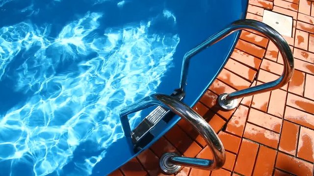 Overlooking the water and stairs to the pool