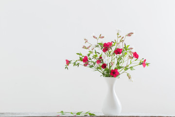 summer flowers in white vase