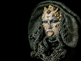 Monster face with white eyes, thorns and warts