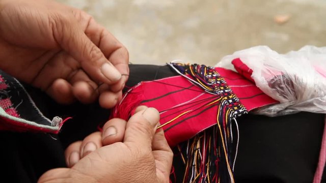 Details of Yao ethnic minority women hand weaver in Longsheng, Guangxi, China.