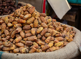Selling nuts and dried fruits at a bazaar in India