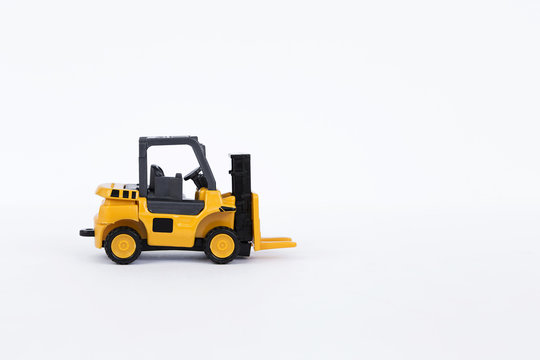 Yellow forklift truck isolate on white background, industrial truck used to lift and move materials short distances