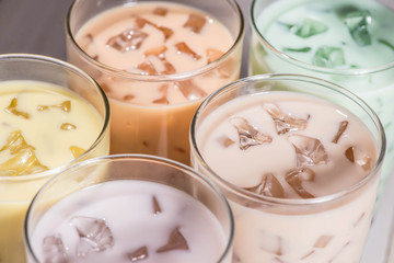 Boba / Bubble tea. Homemade Various Milk Tea with Pearls on wooden table.