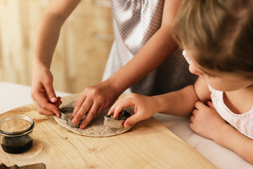 Little sisters girl preparing baking cookies.
