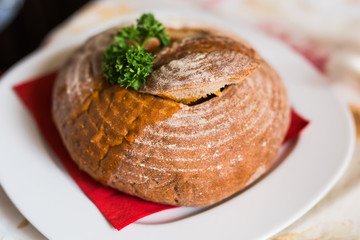 Goulash soup in bread served in a bread bowl