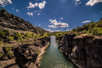 Small River waters running thought beautiful rocks, near Meteora, Kalampaka, Greece