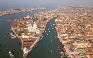 Obraz premium Venice Grand Canal Aerial view at sunrise time with boats, typical venetian buildings with bright roofs. 