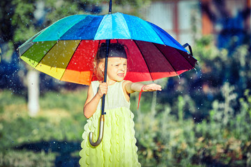 A girl in an umbrella in her hand