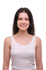 Fototapeta premium Young attractive girl smiling on a white background. Portrait. Beautiful woman.