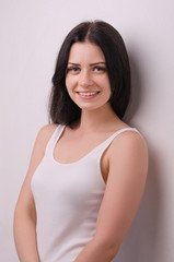 Obraz premium Young attractive girl smiling on a white background. Portrait. Beautiful woman.