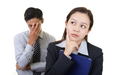 苦悩するビジネスマンとOL