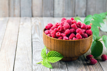 Sweet fresh raspberry and mint on the wooden table