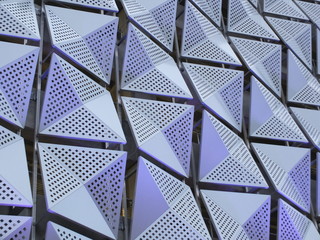 futuristic metal geometric cladding composed of angular metal sheets with triangle pattern