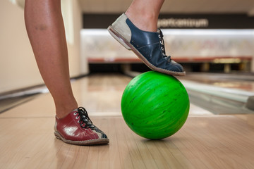 Fototapeta na wymiar Green bowling ball in the bowling center