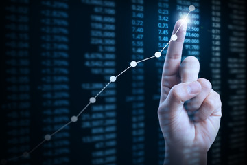 businessman with financial chart symbols coming from hand