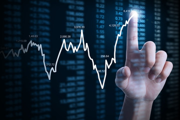 businessman with financial chart symbols coming from hand
