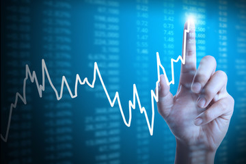 businessman with financial chart symbols coming from hand