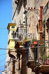 Buildings with interesting balconies and windows, Vittoriosa, Malta.