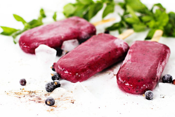 Berry ice cream on a stick.