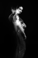 Fototapeta premium Fashion black and white studio portrait of woman with jewelry. Mix light scheme