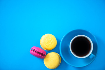Coffee and macaroon cookies, flat lay, vibrant colors