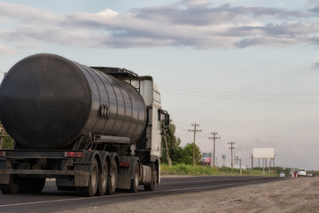 Obraz na płótnie Canvas truck with fuel tanker at road