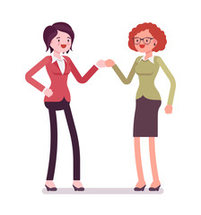 Businesswomen fist bump and smiling
