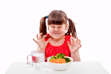Obraz na płótnie Canvas Small girl child hates healthy food. Child isolated on white background
