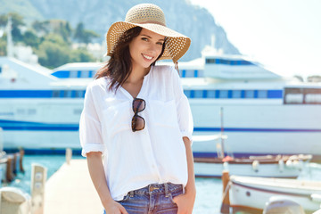 Portrait of a pretty girl walking at the marina - 166326157