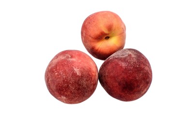 A few ripe peaches isolated on a white background