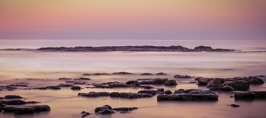 Fototapeta na wymiar Dawn sea rocks