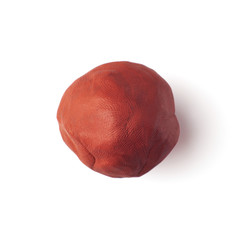 brown piece of plastic on a white background
