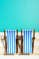 Two striped beach chairs in light