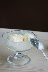 Balls of ice cream in glass bowl