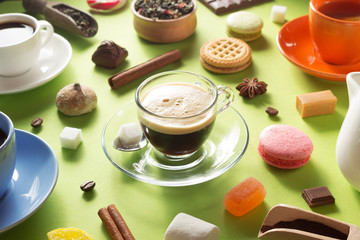 cup and ingredients at green paper
