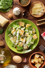 caesar salad in plate at wood
