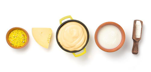 cheese sauce in bowl isolated on white