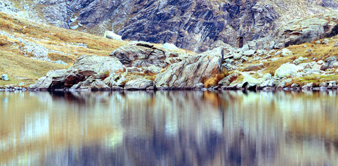 Reflection of a mountain on a lake 