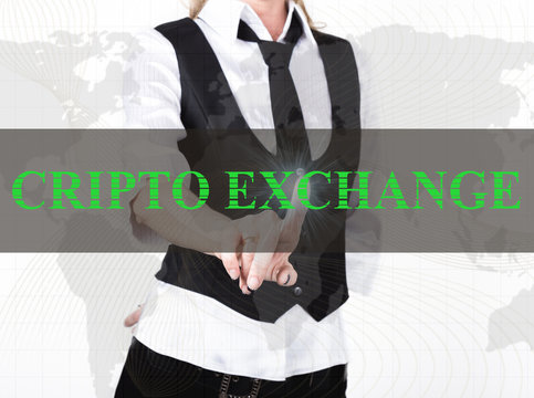businesswoman in a jacket and tie pressing cripto exchange button of a virtual screen. exchange and production of crypto currency concept