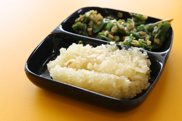 minced garlic on black bowl