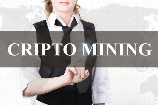 businesswoman in a jacket and tie pressing cripto mining button of a virtual screen. exchange and production of crypto currency concept