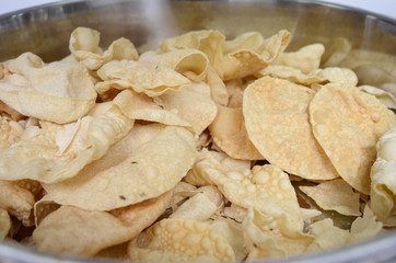 famous indian snack called papadam, can be taking together with rice