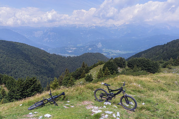 Fototapeta na wymiar Mountain bikes at Mozic, above Soriska planina with Julian alps in the background.